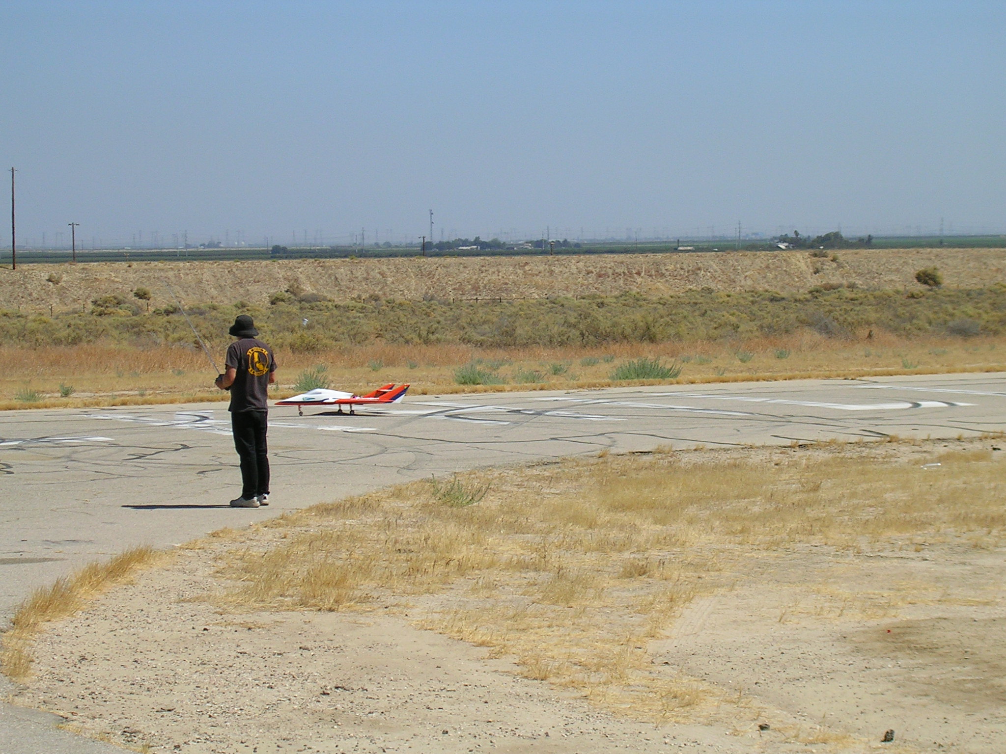 The jet zooms past John on the takeoff roll.